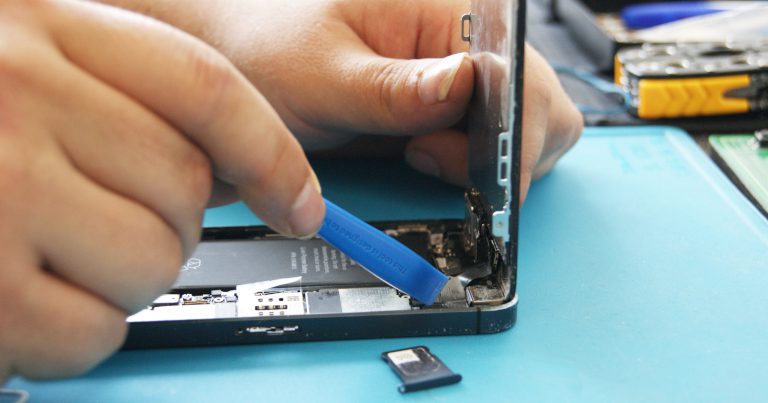person repairing iphone